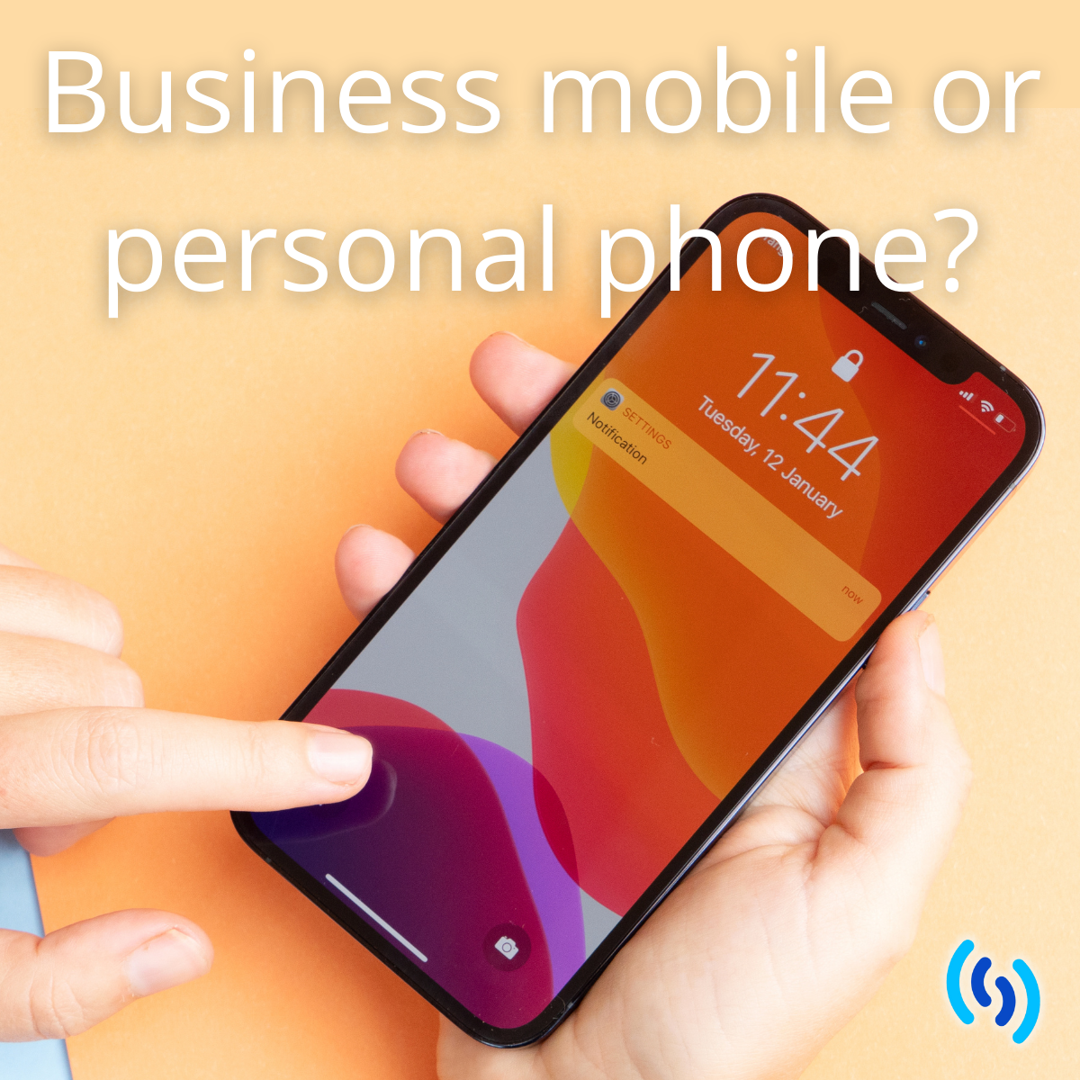 Modern smartphone held in someone's hand with an orange screensaver. Background of image is pale orange